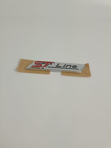 EMBLEMAT LOGO ST LINE PRAWY / LEWY PRZEDNI BŁOTNIK G1BB-16B114-AA 2044452