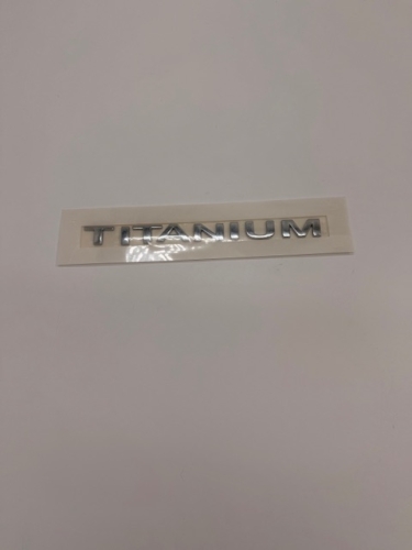 EMBLEMAT NAPIS TITANIUM FOCUS KUGA MONDEO 7M51-42528-DD 1719464